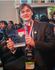 DECA student from Cape Fear High poses with medallion won at the state conference