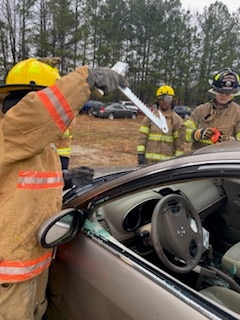 Firefighting academy students practice an emergency drill
