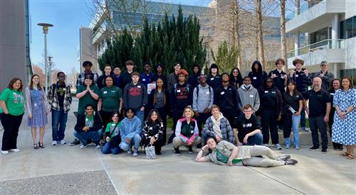 Group photo of students in the IT academy outside of Cisco 