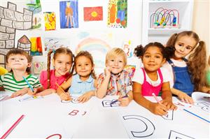 Group of kids coloring and making pictures 