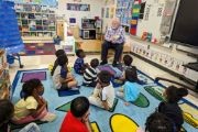  image of Michael Boose reading to PK students